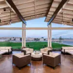 Custom community amenities with angled shade structure, string lights and multiple seating areas.