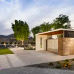 Custom community amenities with covered mailboxes, artificial turf and multiple seating areas.