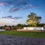 Custom community entrance with large water feature, roundabout driveway and real grass.