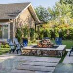 Custom square fire pit with Jesus steps, large planters and large metal trellis.