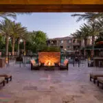 Custom community amenities with custom fire pit, metal pool fencing and multiple outdoor seating areas.