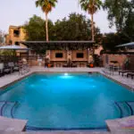 Custom community amenities with community pool, cantilevered shade structure and outdoor TVs.