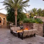 Custom community amenities with fire pit, metal pool fencing and multiple outdoor seating areas.