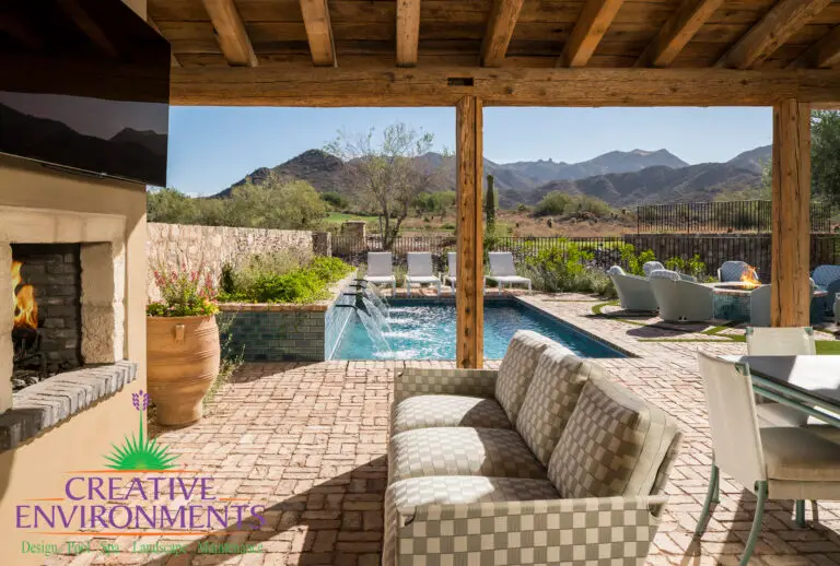 Backyard design with pool, outdoor TV and fireplace.