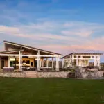 Custom community amenities with angled sahde structure, water feature and real grass.