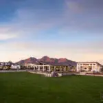 Custom community amenities with real grass, angled shade structure and multiple water features.
