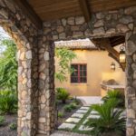 Backyard design with outdoor BBQ, pavers and plants.
