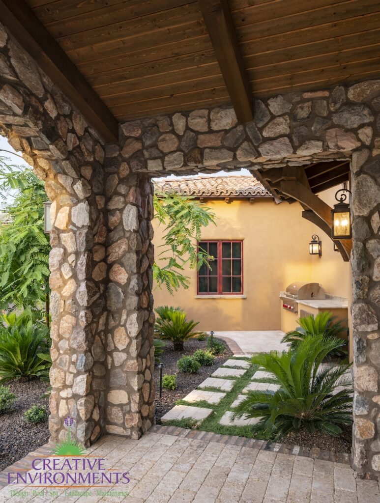 Backyard design with outdoor BBQ, pavers and plants.