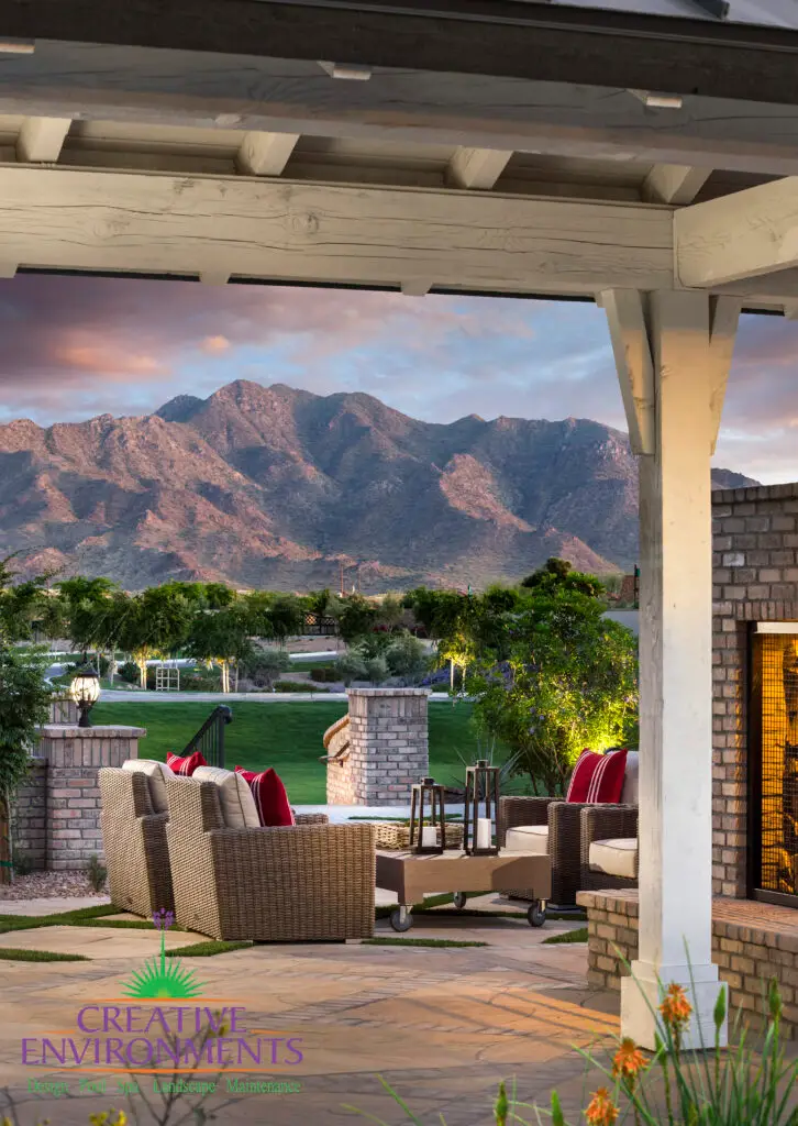 Custom community landscape design with shade structure with multiple seating areas, shade structure and real grass.