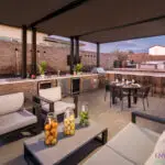 Backyard design with shaded, outdoor kitcen and water feature.
