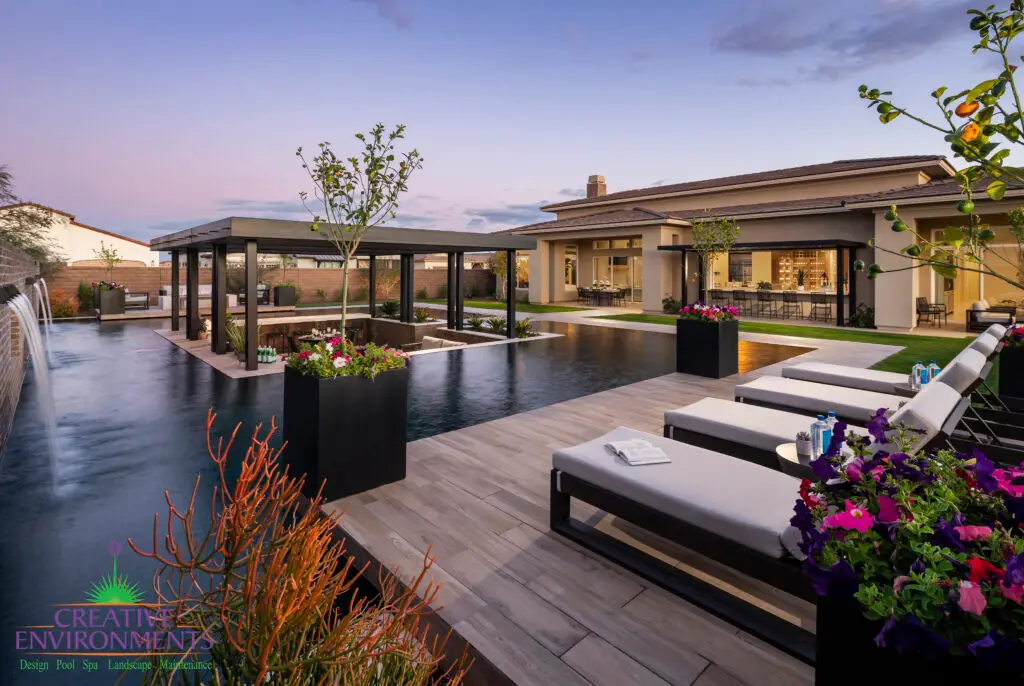 Backyard design with metal planters and annual flowers.