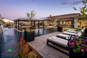 Backyard design with metal planters and annual flowers.