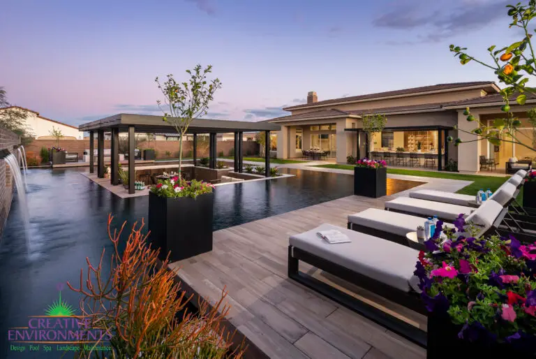 Backyard design with metal planters and annual flowers.