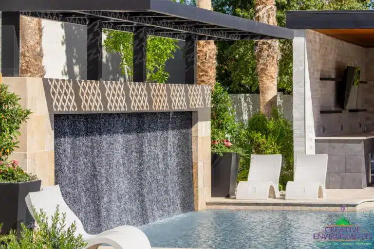 Backyard design with shaded water wall into pool