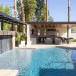Backyard design with misters, outdoor kitchen and pool.