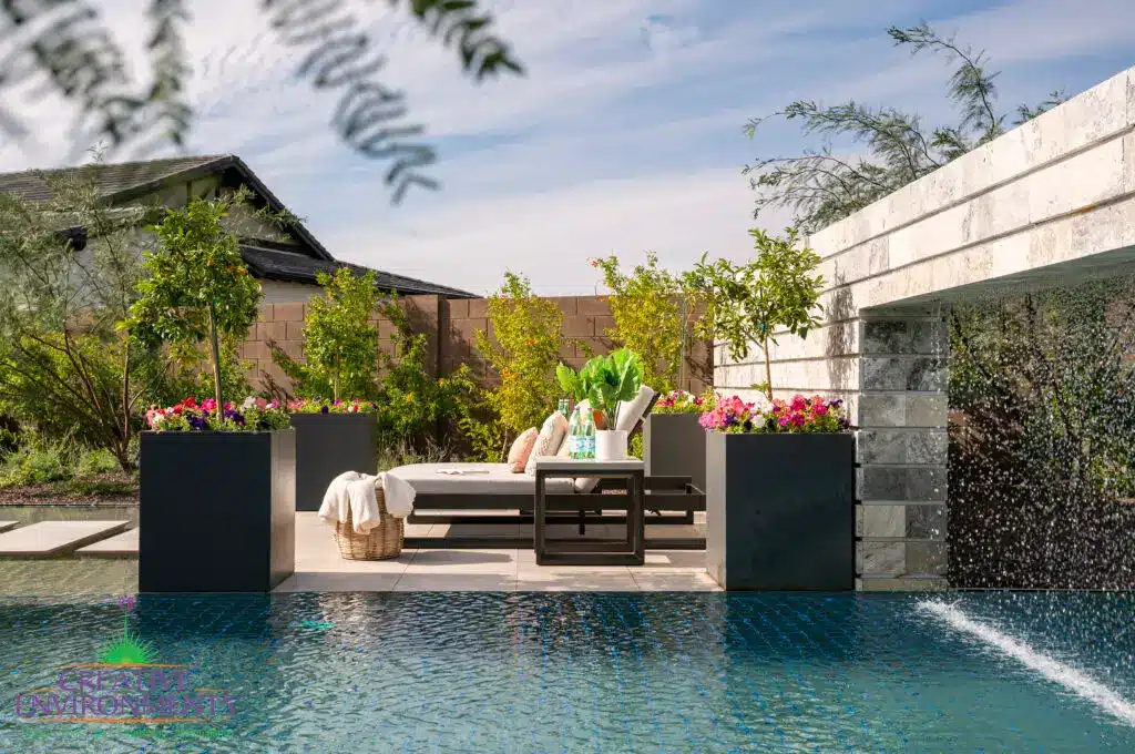 Backyard design with metal planters and rain curtain.