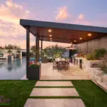 Backyard design with angled shade structure and natural stone steps.