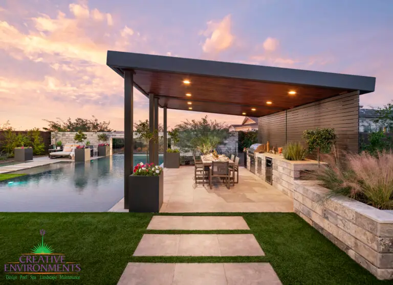 Backyard design with angled shade structure and natural stone steps.
