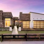 Front yard design with desert plants and real grass.
