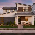 Front yard design with real grass and organized planting.