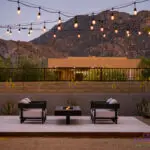 Custom backyard design with desert contemporary vibes, cantilevered fire table and outdoor seating area.