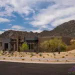 Custom front yard design with desert landscape design and paver walkway.