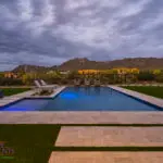 Custom backyard design with pool, Jesus steps and artificial turf.