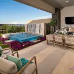 Custom backyard design outdoor kitchen and dining area, outdoor TV and acrylic spa.