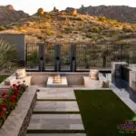 Backyard design with sunken fire feature and natural stone steps.