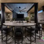 Backyard design with outdoor dining area and outdoor fan.