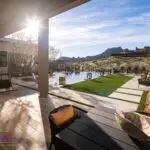 Backyard design with natural stone steps, pool and outdoor fan.
