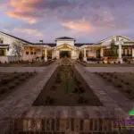 Custom community amenities with string lights, organized planting and multiple seating areas.