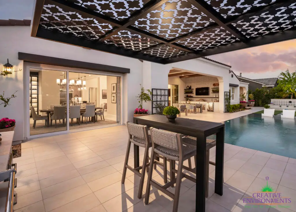 Custom backyard design with cantilevered metal shade structure that doubles as metal statement piece.