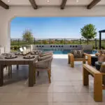 Custom backyard design with deco-tile backsplash, multiple seating areas and recessed lighting.