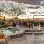 Backyard design with multiple seating areas and contemporary desert vibes.