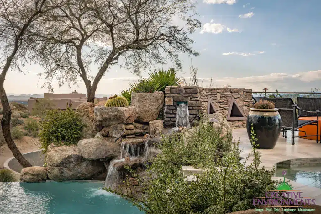 Backyard design with triangular accents and potted plants