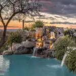 Backyard design with cacti and natural stone water fountain