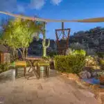 Backyard design with custom trellis and cacti