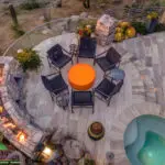 Backyard design with circular spa and top fire feature.