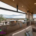 Custom shade structure with outdoor kitchen complete with outdoor BBQ, outdoor storage and multiple seating areas.