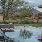 Custom backyard design with raised spa and Jesus steps.
