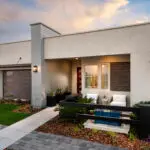 Front yard design with water feature and metal planters