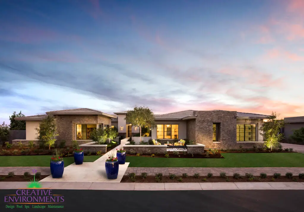 Custom front yard design with outdoor seating area, fire feature and artificial turf.