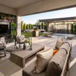 Custom backyard design with living wall, multiple seating areas and rain curtain water feature.