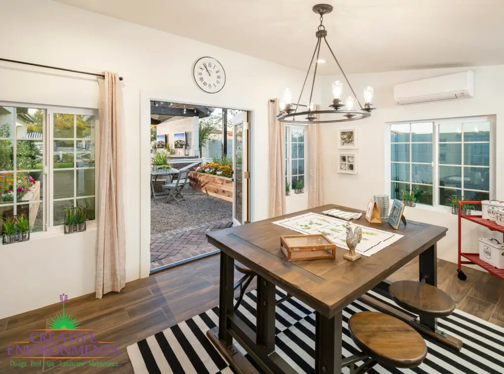 Custom indoor/outdoor design fusion, multiple planters and outdoor seating areas.