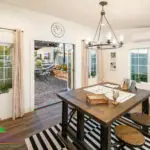 Custom indoor/outdoor design fusion, multiple planters and outdoor seating areas.