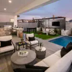 Backyard design with outdoor entertainment area and outdoor kitchen
