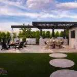 Custom backyard design with hanging wok fire pit, circular steps and cantilevered shade structure.