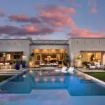Custom backyard design with artificial turf, acrylic pool and baja step.