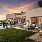 Custom backyard design with real grass, multiple seating areas and zero-edge pool.
